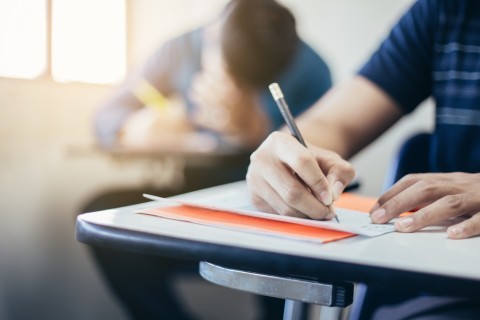 Student at desk taking exam