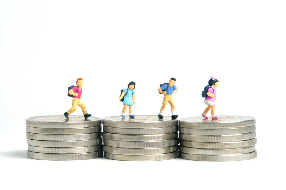 Children walking over stacks of quarters